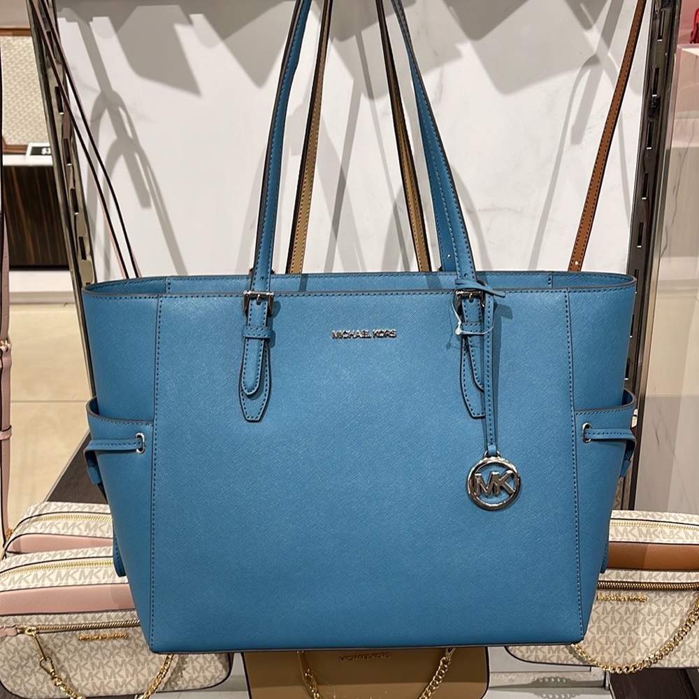 Michael Kors Gilly Large Drawstring Travel Leather Top Zip Tote
 Color: TEAL
NWT - Picture 14 of 16